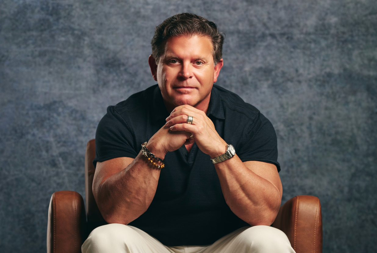 Dr. Rudy Triana seated in a leather chair